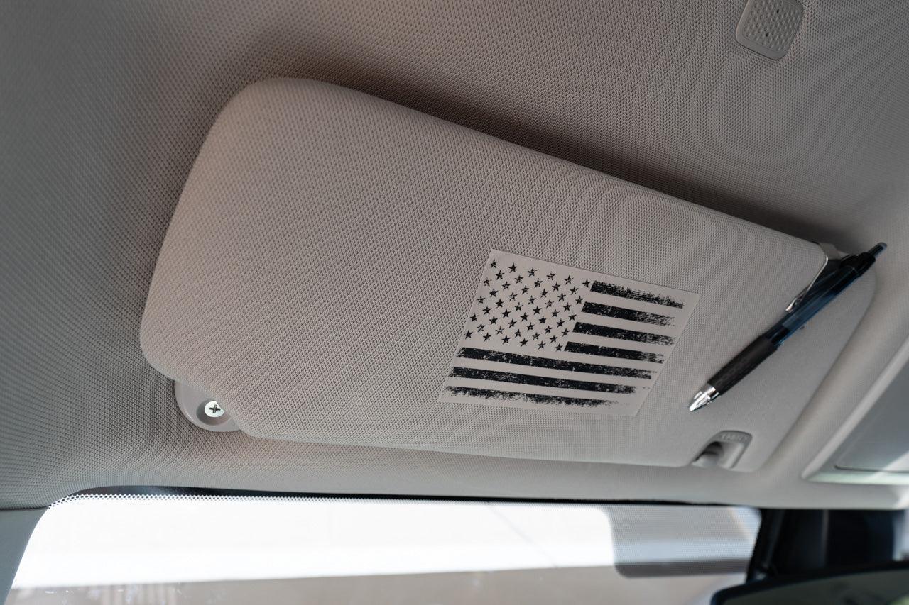 Vinyl interior sun visor airbag label overlay featuring distressed American flag design for 2016-2023 Toyota Tacoma by StickerFab