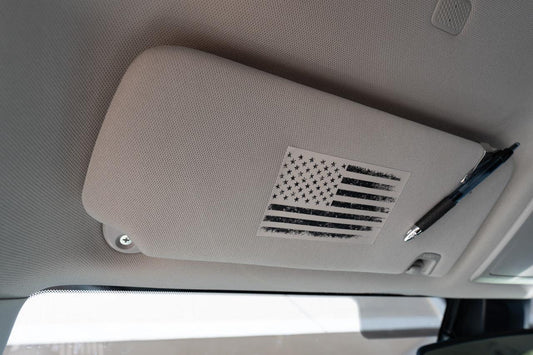 Vinyl interior sun visor airbag label overlay featuring distressed American flag design for 2016-2023 Toyota Tacoma by StickerFab