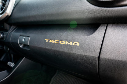 Vinyl glove box with Tacoma logo inlays for 2016-2023 Toyota Tacoma interior, standard series by StickerFab.
