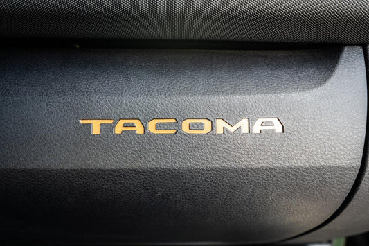 Vinyl glove box with Tacoma logo inlays, standard series interior accessory for 2016-2023 Toyota Tacoma by StickerFab