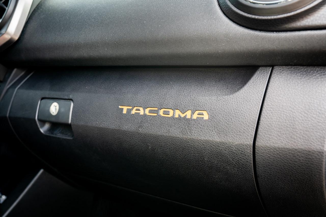 Vinyl glove box with Tacoma logo inlays for 2016-2023 Toyota Tacoma interior, standard series, by StickerFab