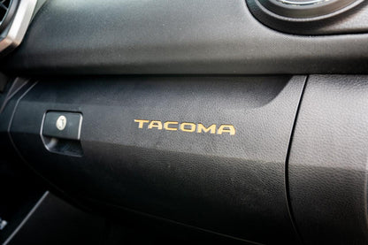 Vinyl glove box with Tacoma logo inlays for 2016-2023 Toyota Tacoma interior, standard series, by StickerFab