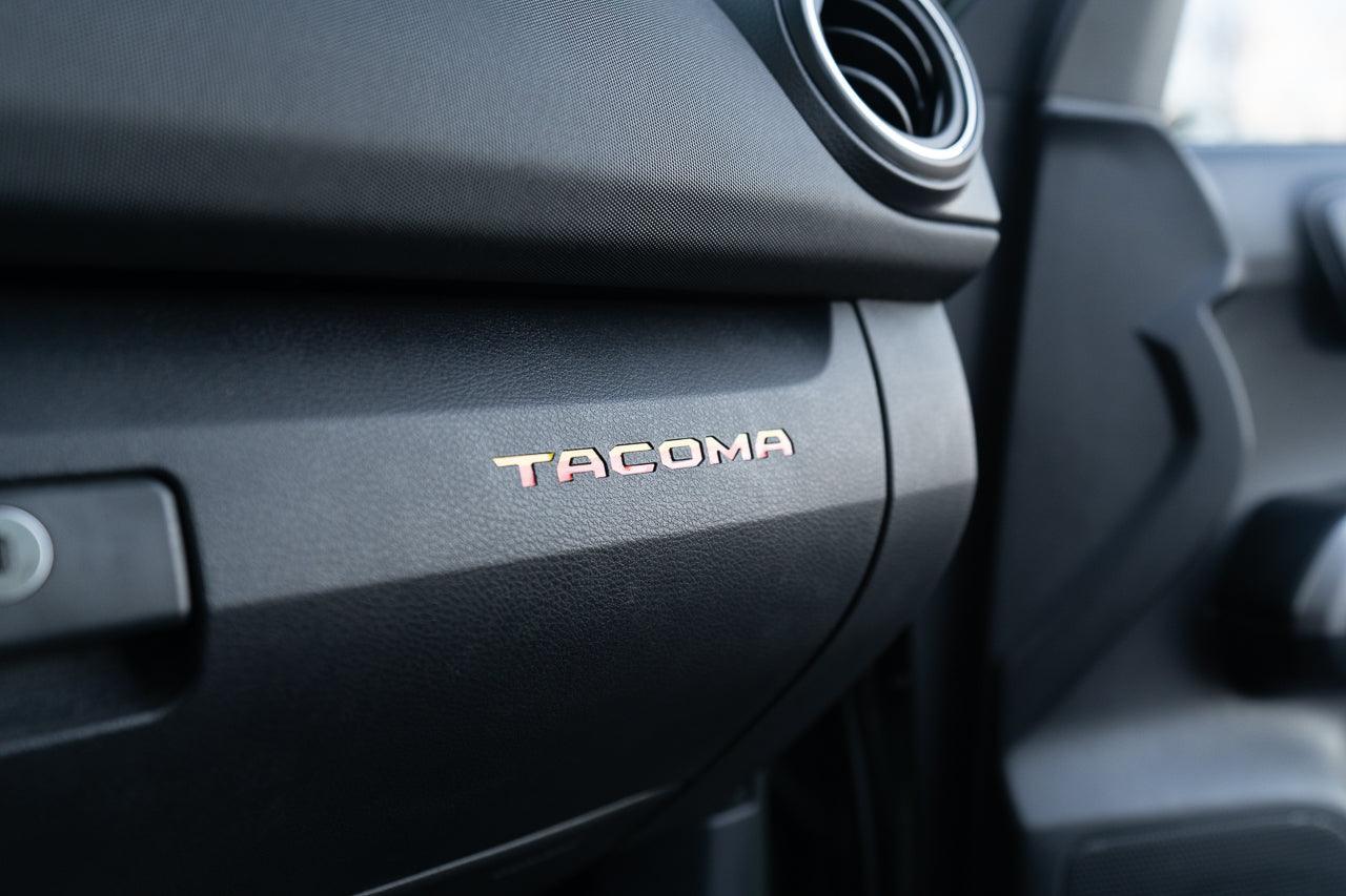 Tacoma glove box with StickerFab printed vinyl logo inlays, custom interior accessory for 2016-2023 Tacoma trucks.
