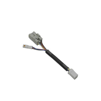 JDMuscle F1 light plug and harness mounted on a 2015-2025 WRX or 2015-2021 STI vehicle for LED light installation.