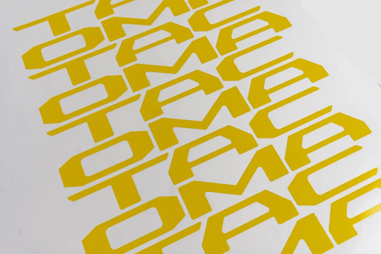 Vinyl TACOMA Tailgate Inlay Letters for 2024+ Toyota Tacoma, exterior decal with black lettering on tailgate.