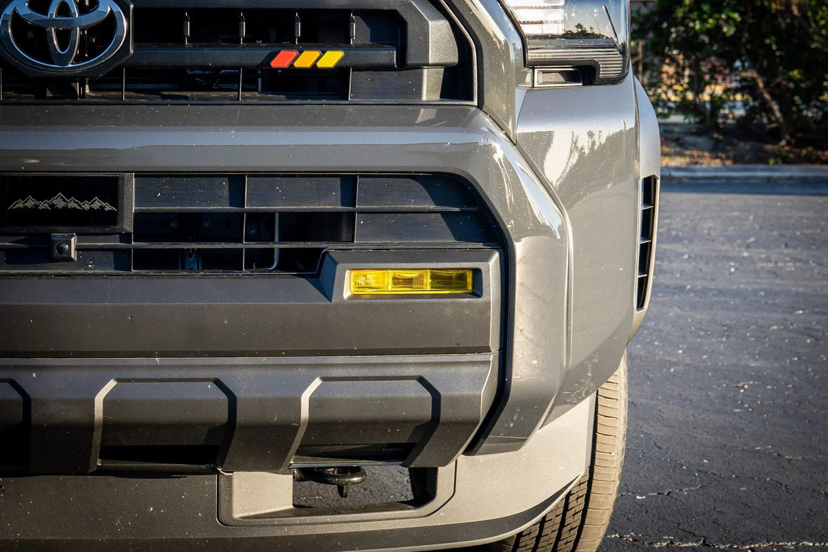 Vinyl fog light overlays for 2024+ Toyota Tacoma, exterior accessory by StickerFab, shown on vehicle with installed overlays