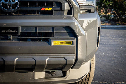 Vinyl fog light overlays for 2024+ Toyota Tacoma, exterior accessory by StickerFab, shown on vehicle with installed overlays