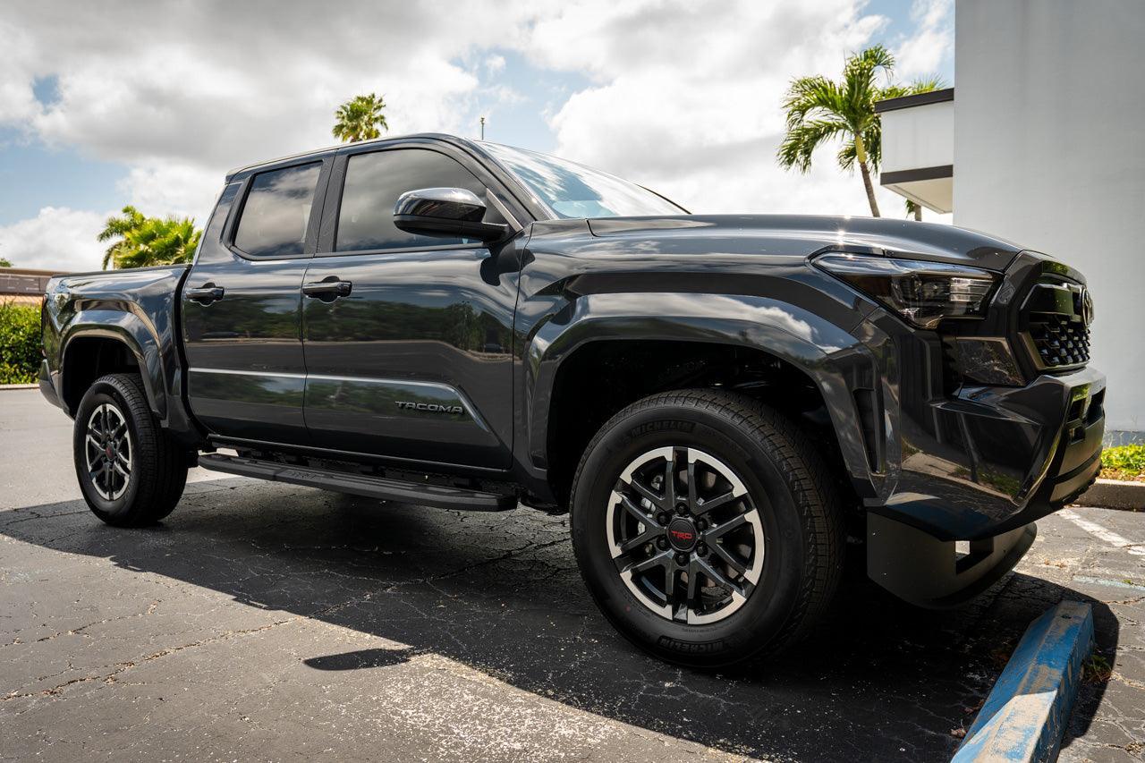 Front smoked sidemarker overlays for 2024+ Toyota Tacoma, vinyl exterior accessories by StickerFab, shown on vehicle.
