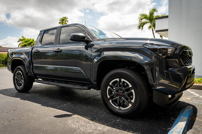 Front smoked sidemarker overlays for 2024+ Toyota Tacoma, vinyl exterior accessories by StickerFab, shown on vehicle.