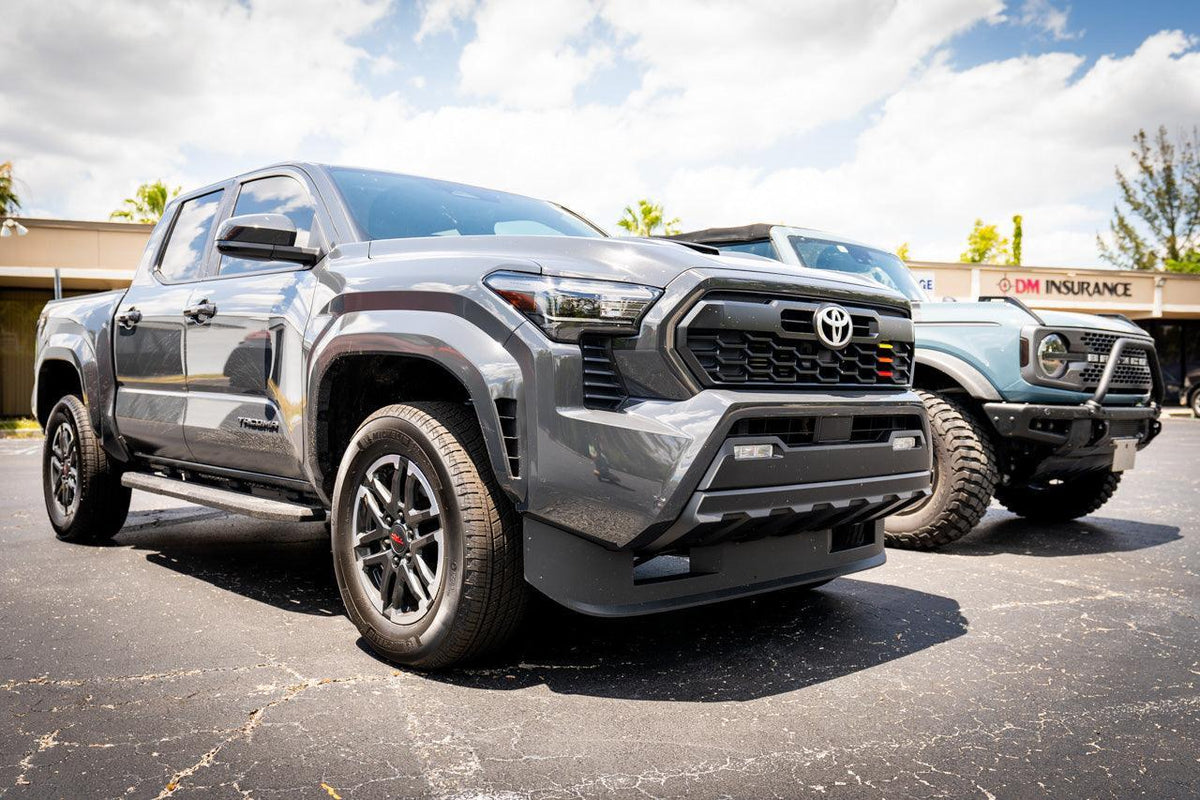 TRD Style Heritage Grille Tri Bar Overlays for 2024+ Toyota Tacoma, vinyl exterior accessory by StickerFab, shown on vehicle front.