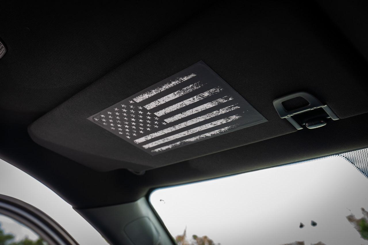 Sun visor airbag label overlay with distressed American flag design for 2024+ Toyota Tacoma interior, vinyl sticker by StickerFab.