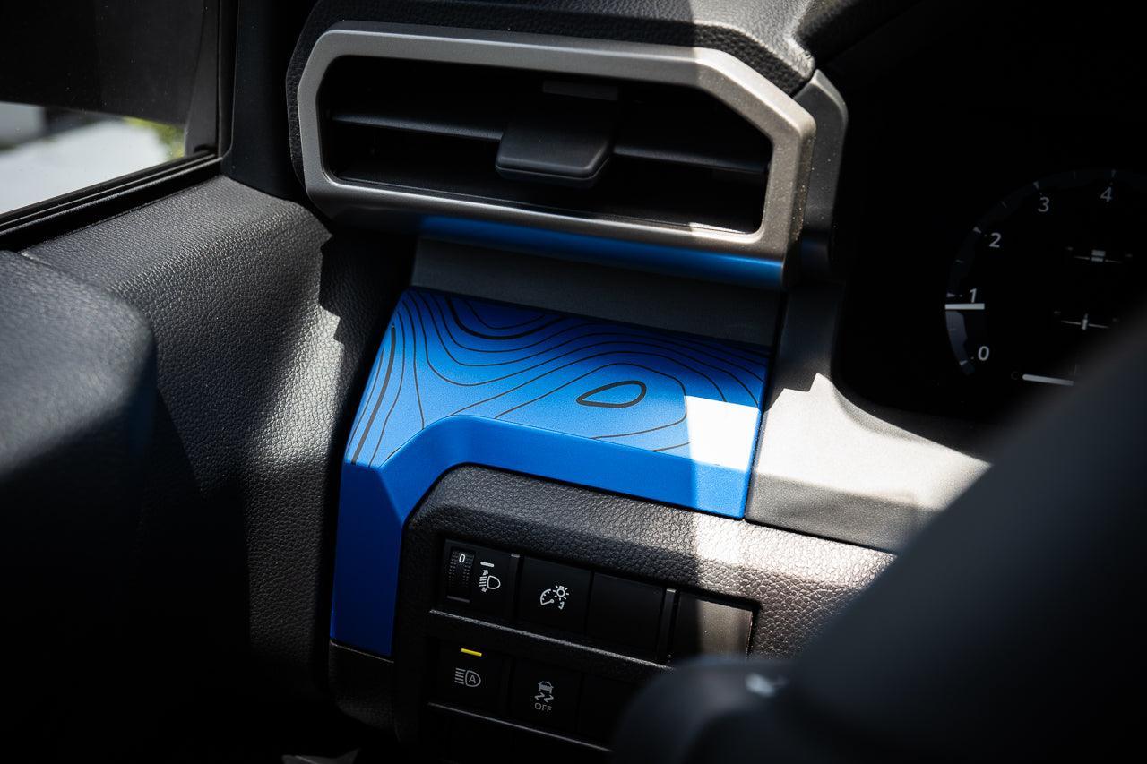 Vinyl interior 3-piece topographic map dash overlays for 2024+ Toyota Tacoma by StickerFab, featuring detailed map designs.