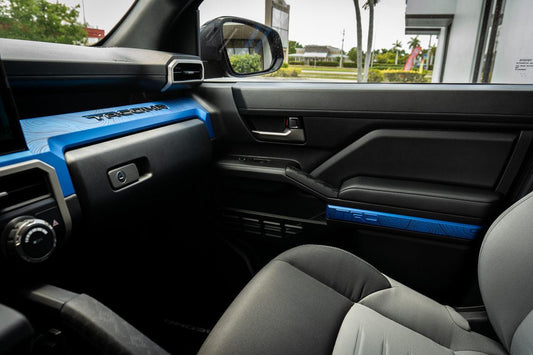 Vinyl interior door topographic map overlays for 2024+ Tacoma by StickerFab, showcasing detailed topography on a vehicle door.