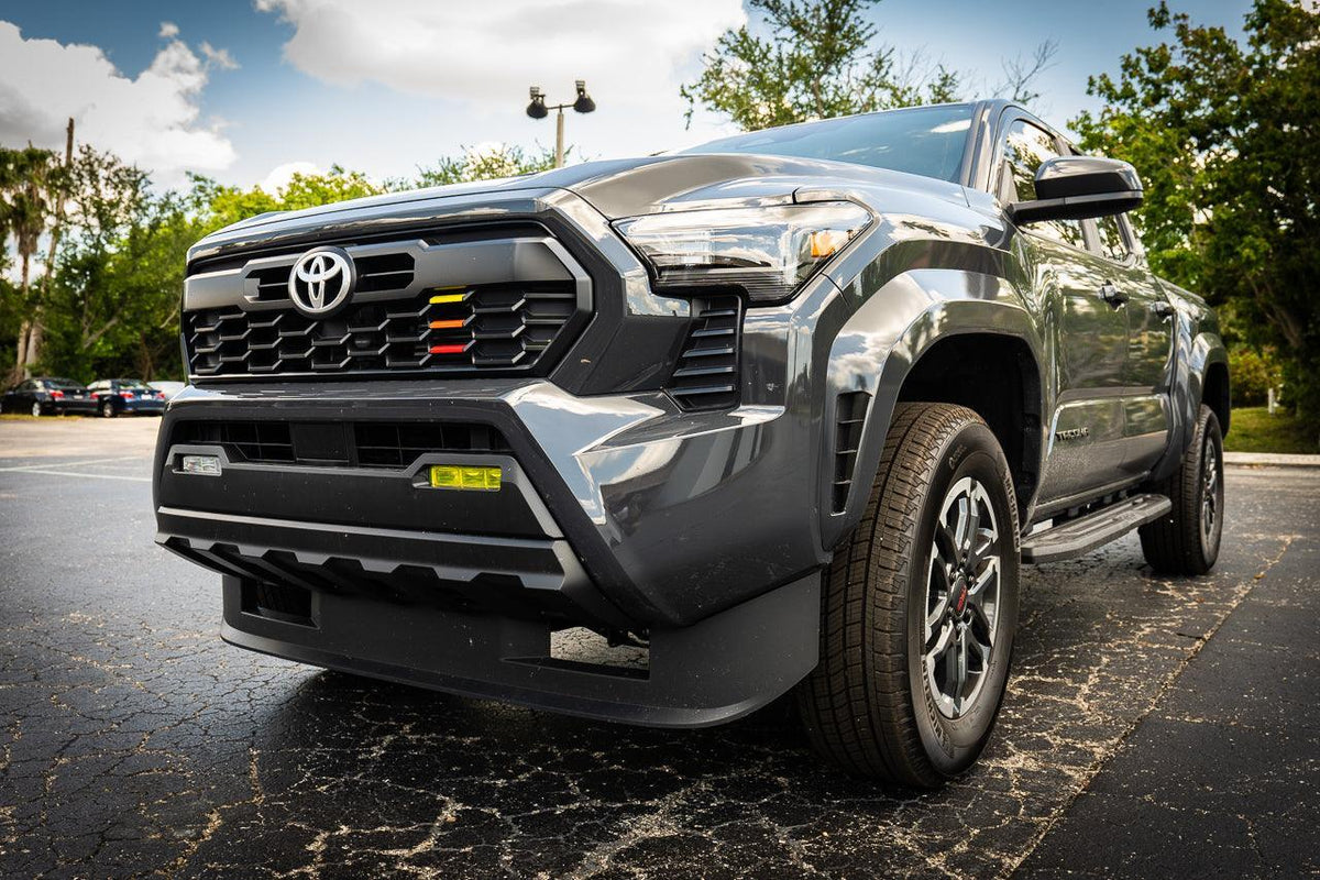 Vinyl fog light overlays for 2024+ Toyota Tacoma, exterior accessory by StickerFab, showing the sleek, custom-fit design on vehicle fog lights.