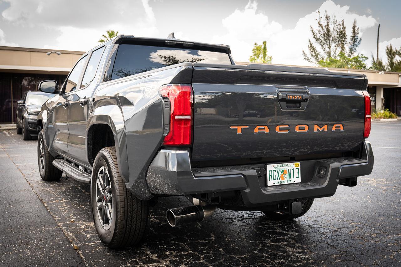Tailgate handle inlay letters in vinyl for 2024+ Toyota Tacoma, exterior decal by StickerFab with standard vinyl finish.