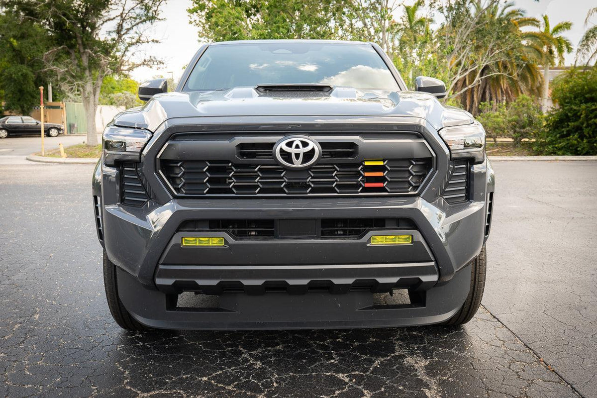 Vinyl fog light overlays for 2024+ Toyota Tacoma, exterior accessory by StickerFab, shown installed on vehicle.