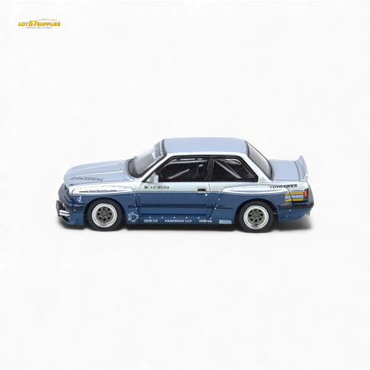 Silver and blue INNO64 Pandem E30 M3 BMW diecast model car, detailed 1:64 scale replica with realistic features.