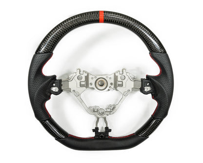 FactionFab carbon and leather steering wheel for 2017+ Subaru BRZ and Toyota 86, featuring a sleek sporty design and high-quality materials.
