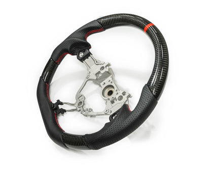 FactionFab carbon and leather steering wheel for 2017+ Subaru BRZ and Toyota 86, featuring a sporty design and ergonomic grip.