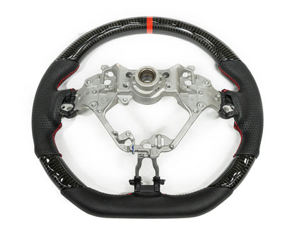 FactionFab carbon and leather steering wheel for 2017+ Subaru BRZ and Toyota 86, featuring sporty design and high-quality materials.
