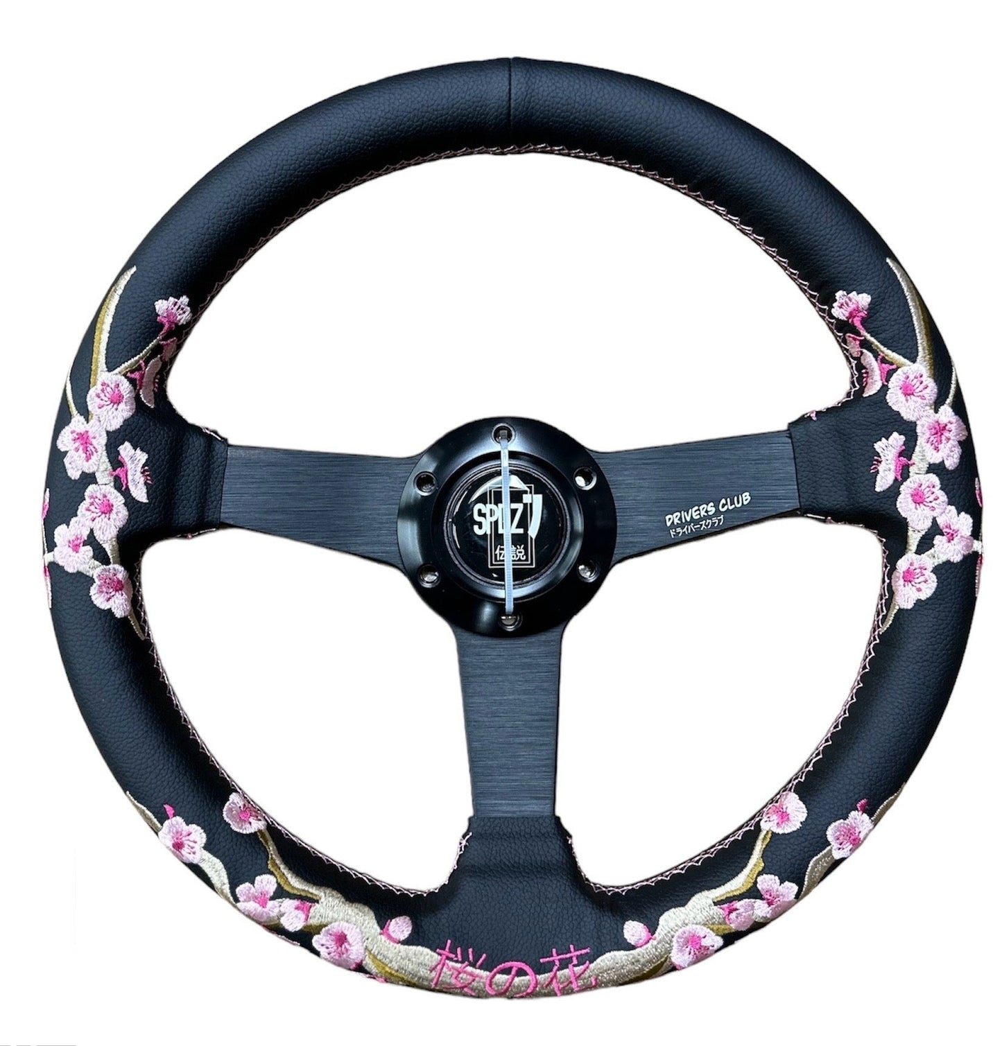 Speedzone Performance LLC SPDZ1 Sakura steering wheel with black grip and silver accents, showing detailed close-up of the wheel's design.