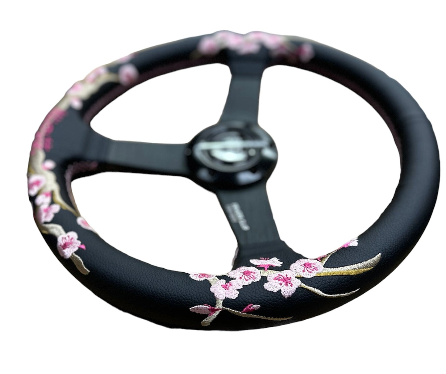 SPD Z1 Sakura Steering Wheel V2 by Speedzone Performance LLC, close-up view showing textured grip and sleek design.