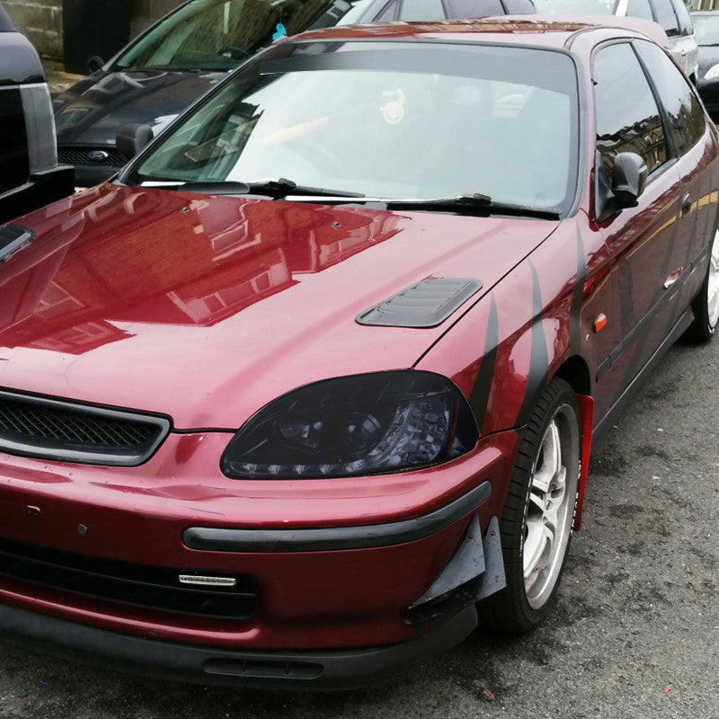 Smoked Spec-D R8-style projector headlights for 96-98 Honda Civic, featuring sleek design and advanced lighting technology.
