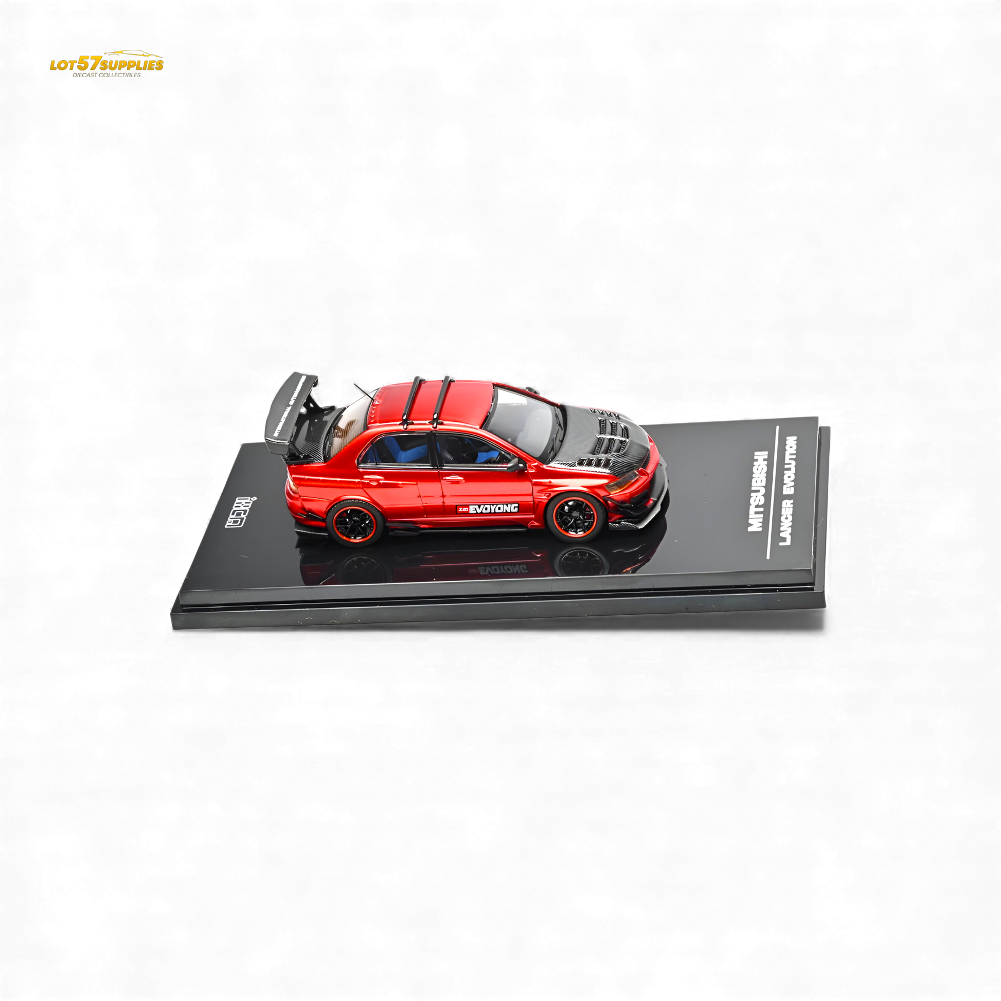 Metallic red Mitsubishi Lancer Evo IX diecast model in 1:64 scale, showcasing detailed design and vibrant color.