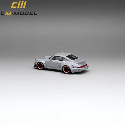 Gray diecast Porsche 964 Widebody model in 1:64 scale, showcasing detailed features and accurate design.