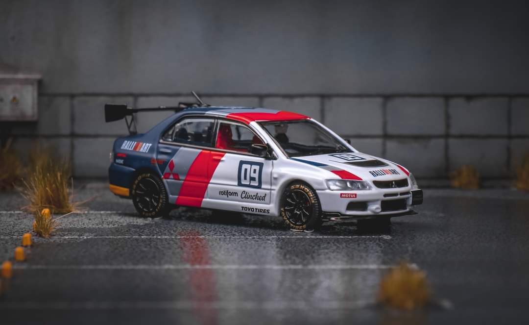 Diecast Mitsubishi Evolution 9 Ralliart model car in 1:64 scale by Lot57Supplies Diecast Shop, detailed remote control vehicle.