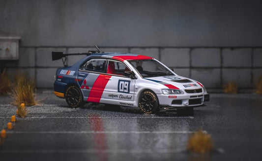 Diecast Mitsubishi Evolution 9 Ralliart model car in 1:64 scale by Lot57Supplies Diecast Shop, detailed remote control vehicle.