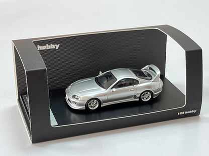 Silver 1:64 scale Toyota Supra JZA80Z diecast model by Lot57Supplies, detailed close-up of the toy car's exterior and design.