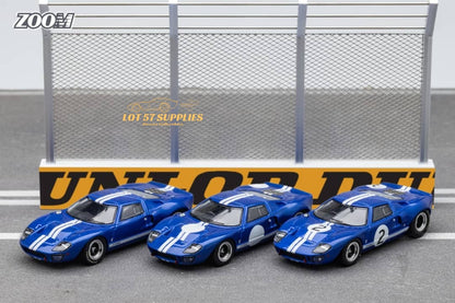 Blue Ford GT40 MK1 diecast car in 1:64 scale by Lot57Supplies, detailed model with visible racing number #2.