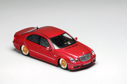 Red Mercedes-Benz E63 AMG W211 diecast model by Lot57Supplies, showing detailed lowered design in 1:64 scale.