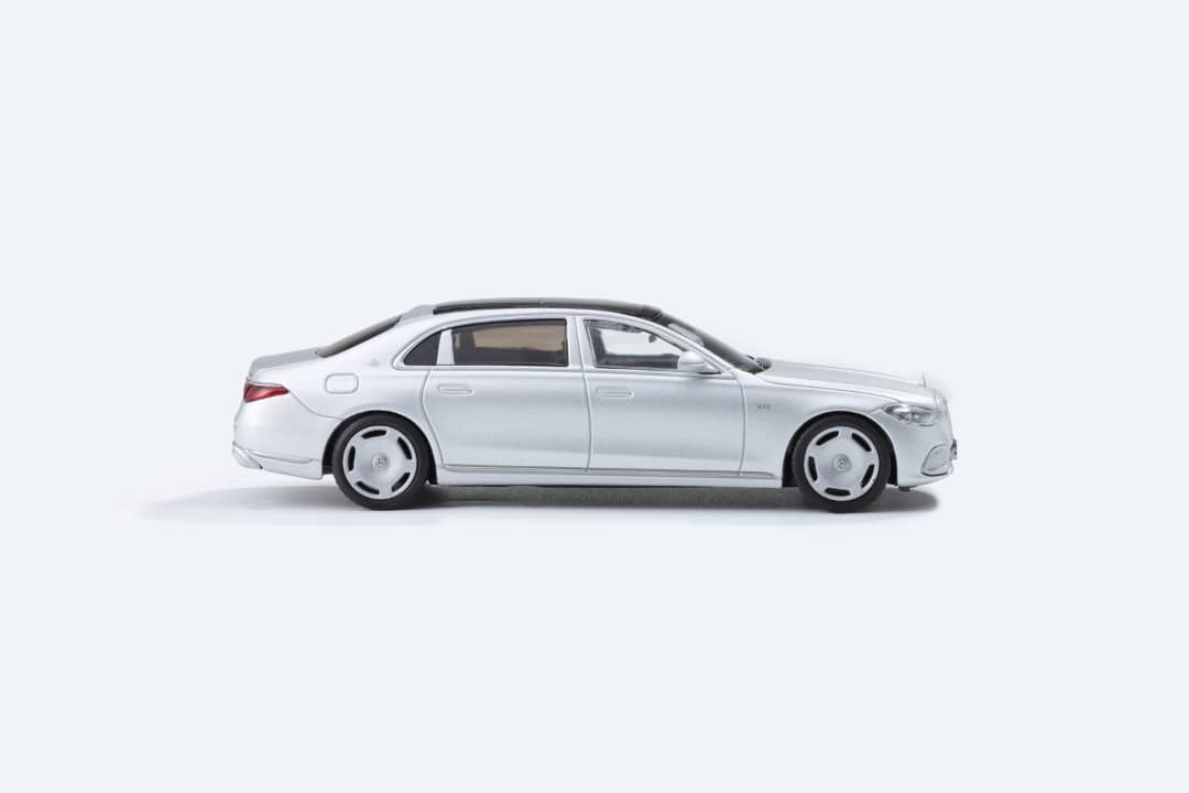Matte silver 1:64 scale Mercedes-Benz Maybach W223 diecast model by Lot57Supplies Diecast Shop, showcasing detailed exterior design.