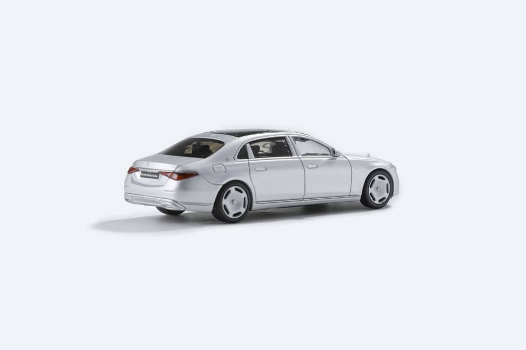 Matte silver 1:64 scale Mercedes-Benz Maybach W223 diecast model by Lot57Supplies Diecast Shop displayed on a white background