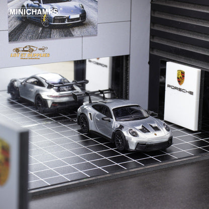 Silver Porsche 911 GT3 RS diecast model in 1:64 scale, detailed miniature car by Minichamps.