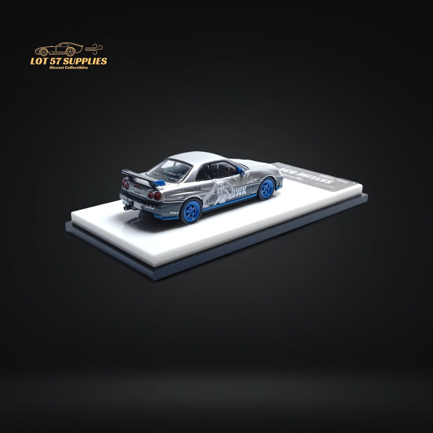 Silver Nissan Skyline R34 25GT Turbo diecast model with Queen livery, 1:64 scale, detailed automotive collectible.