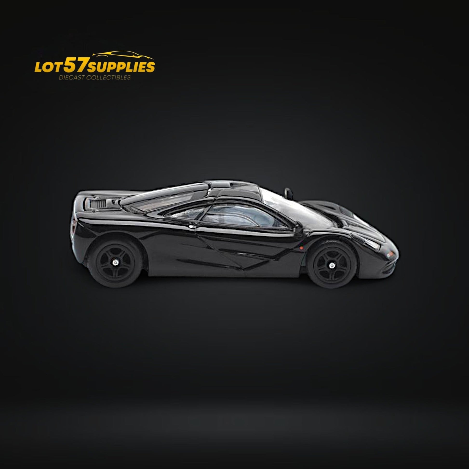 Black McLaren F1 diecast car by Pop Race, 1:64 scale, showcasing detailed exterior and sleek design.