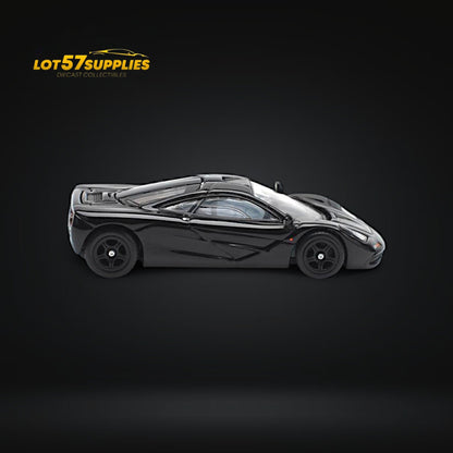 Black McLaren F1 diecast car by Pop Race, 1:64 scale, showcasing detailed exterior and sleek design.