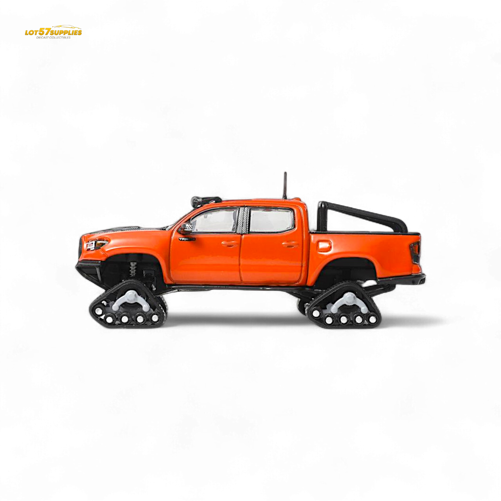 Toyota Tacoma diecast model with orange-red GCD 3PMSF tires, detailed miniature vehicle for display or collection.