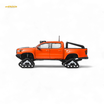 Toyota Tacoma diecast model with orange-red GCD 3PMSF tires, detailed miniature vehicle for display or collection.
