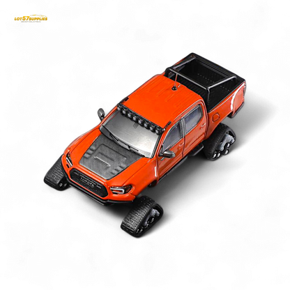 Toyota Tacoma diecast model with orange-red GCD 3PMSF tires, detailed 1:64 scale replica from Lot57Supplies Diecast Shop.