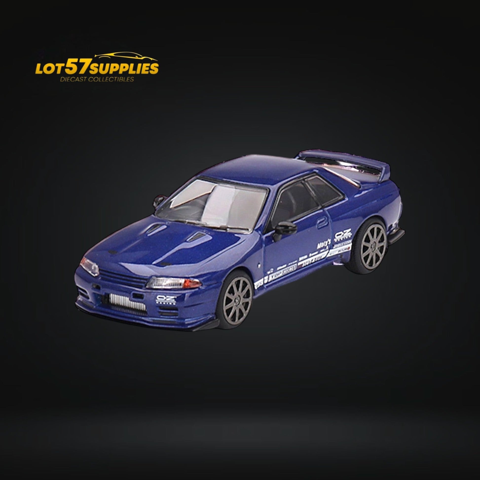 Mini-GT Nissan Skyline GT-R R32 diecast model in metallic blue, 1:64 scale, showcasing detailed design and realistic features.