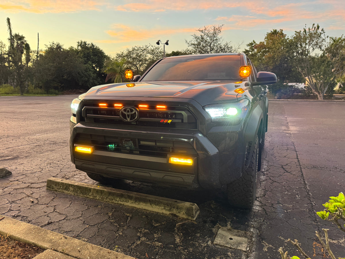 Vinyl fog light overlays for 2024+ Toyota Tacoma, exterior accessory by StickerFab, shown installed on vehicle fog lights.