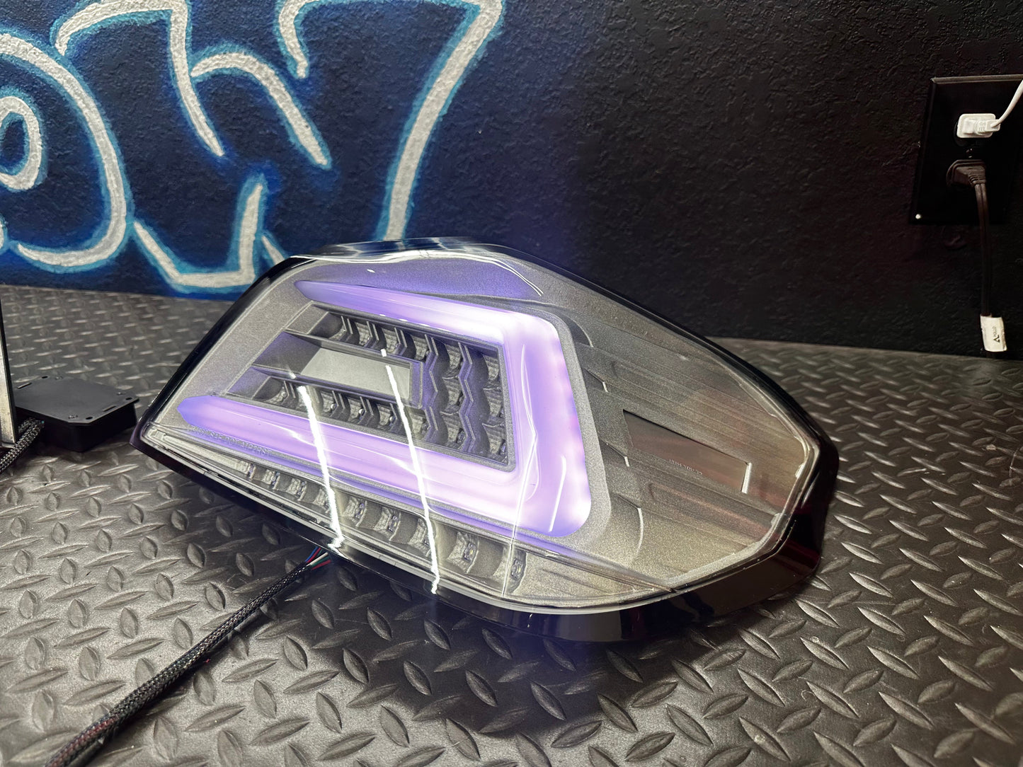 NTXGlow clear RGB color-shifting tail lights installed on a 2015-2021 Subaru WRX/STI, showing vibrant lighting and sleek design.