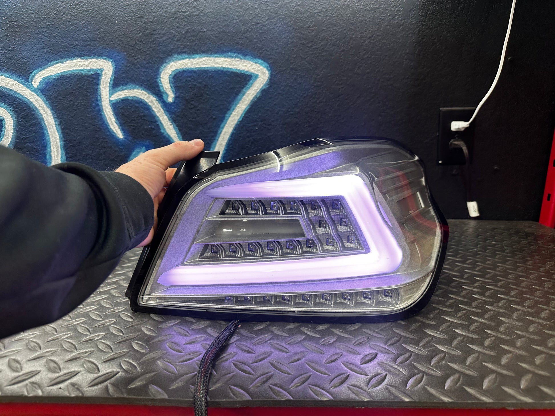 NTXGlow clear RGB color-shifting tail lights for 2015-2021 Subaru WRX and STI, shown installed on the vehicle.