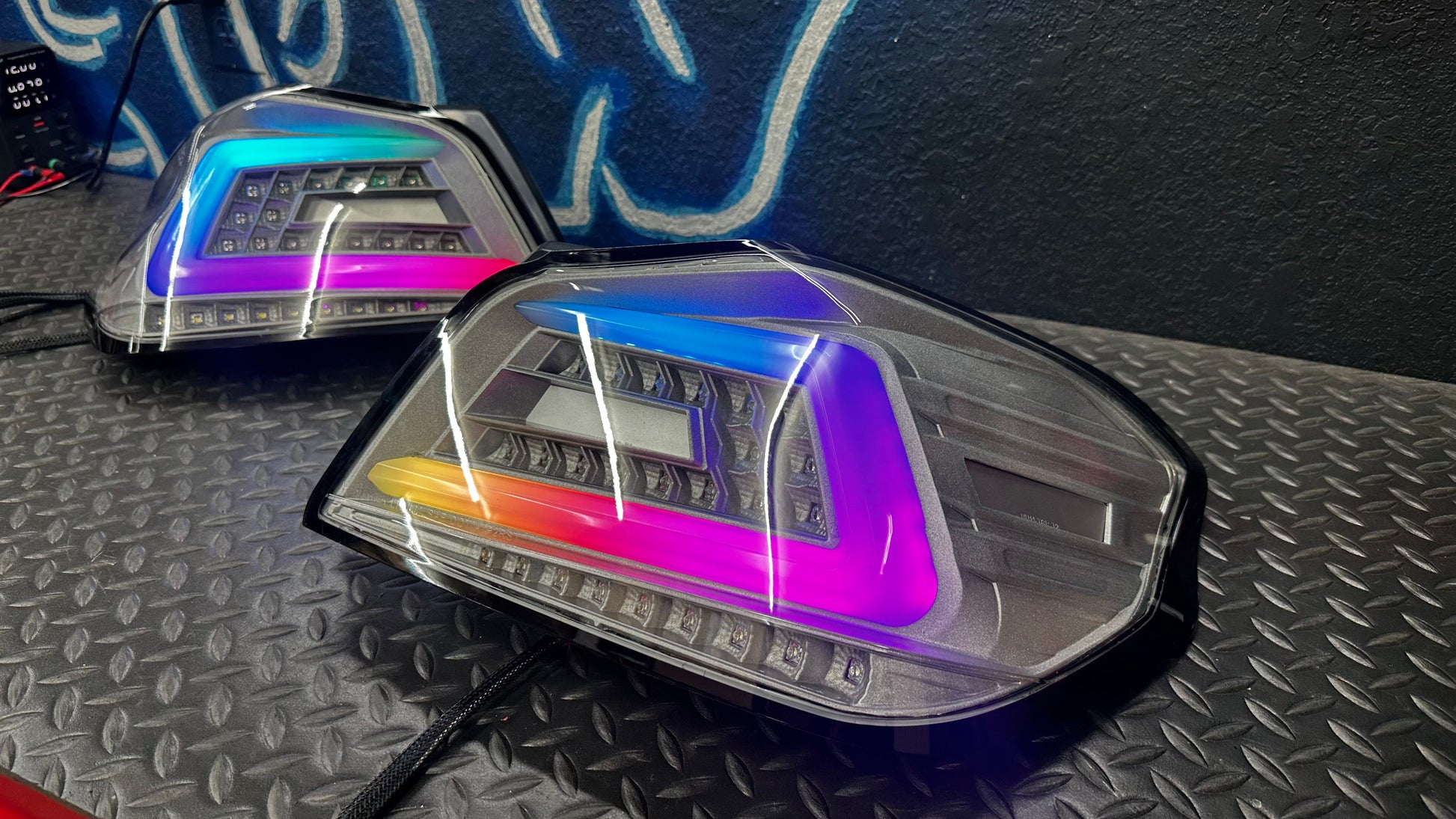 NTXGlow clear RGB color-shifting tail lights for 2015-2021 Subaru WRX/STI, featuring sleek design and vibrant lighting.