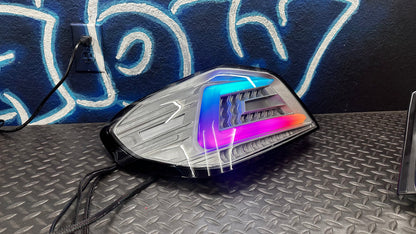 NTXGlow clear RGB color-shifting tail lights for 2015-2021 WRX/STI, featuring sleek design and vibrant LED illumination.
