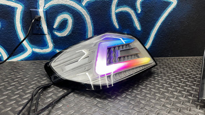 NTXGlow clear RGB color-shifting tail lights for 2015-2021 Subaru WRX/STI, featuring sleek design and vibrant lighting effects.